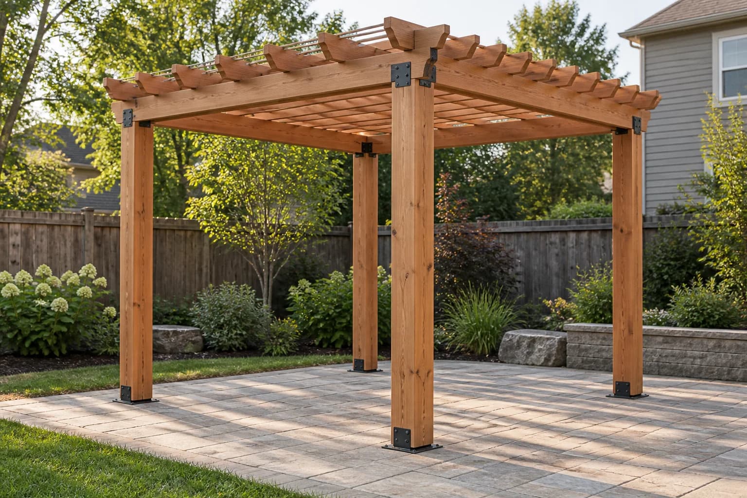 Completed freestanding 10 by 10 foot cedar pergola on a backyard patio