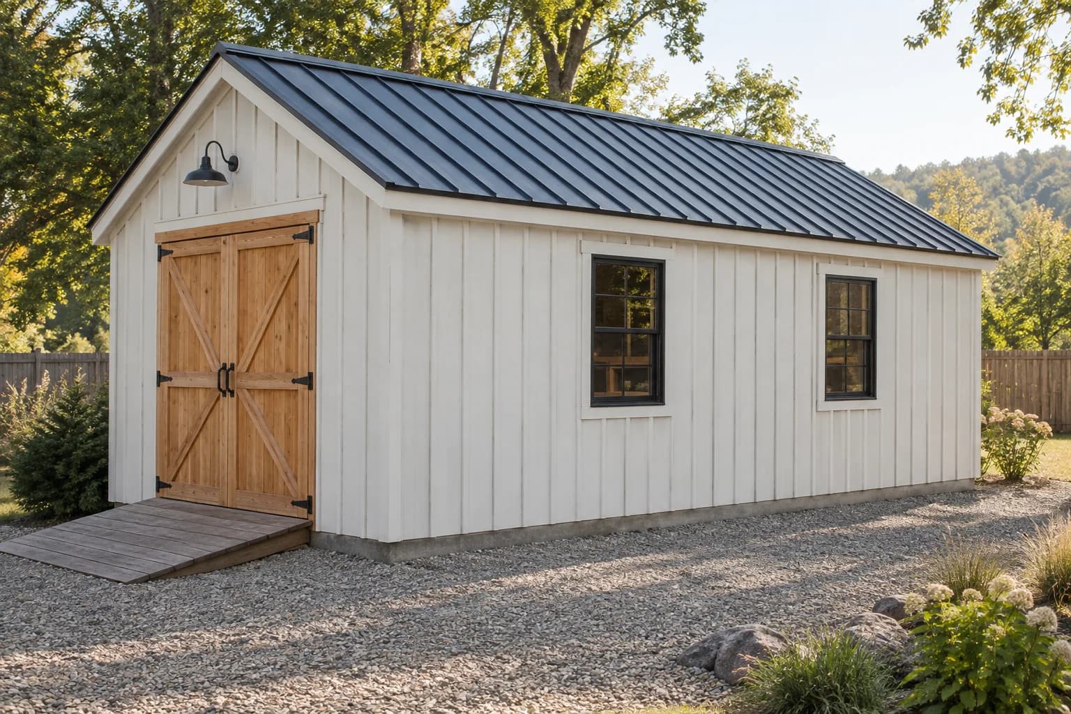 Long white 12 by 20 foot workshop shed with cedar double doors and two side windows